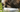 Closeup picture of a dog eating from a dog food bowl.